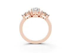 Marquise Cut Diamond Solitaire Ring Set in Rose gold with Cluster Accents on Each Side