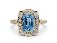 Fancy Blue Emerald Cut Diamond Halo Ring Set in Yellow gold with Pavé-Lined Shoulders and Prong Setting