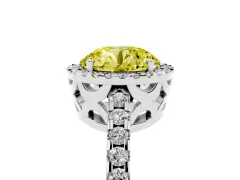 Fancy Yellow Round Cut Diamond Halo Ring Set in Platinum with Pavé Shoulders and Halo-Framed Center