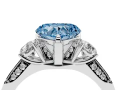 Fancy Blue Heart Cut Diamond Three-Stone Ring Set in Platinum with Pavé Band and Smaller Side Stones