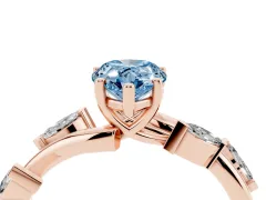 Fancy Blue Pear Cut Diamond Solitaire Ring Set in Rose gold with Twisted Marquise Accent Band