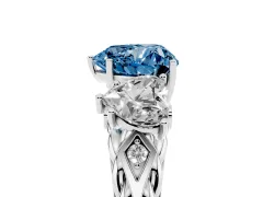 Fancy Blue Heart Cut Diamond Three-Stone Ring Set in White gold with Braided Band