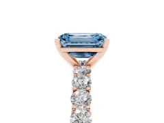 Fancy Blue Emerald Cut Diamond Solitaire Ring Set in Rose gold with Shared Prong Pavé Band