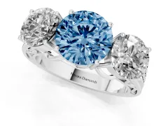 Fancy Blue Round Cut Diamond Three-Stone Ring Set in Silver with Textured Band