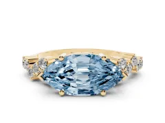Fancy Blue Marquise Cut Diamond Ring Set in Yellow gold with Scattered Round Accents