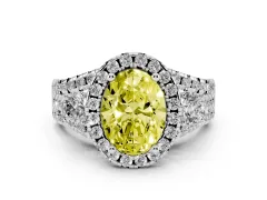 Fancy Yellow Oval Cut Diamond Halo Split Shank Ring Set in White gold with Round Accent Stones and Prong Setting