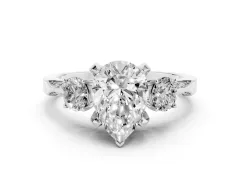 Pear Cut Diamond Three-Stone Ring Set in Platinum with Pavé Band and Smaller Side Stones