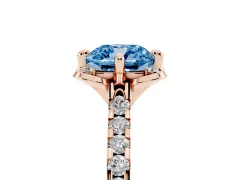 Fancy Blue Cushion Cut Diamond Solitaire Ring Set in Rose gold with Pavé Band and Floral Prong Setting