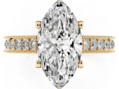 Marquise Cut Diamond Solitaire Ring Set in Yellow gold with Milgrain-Edged Pavé Band and Prong Setting