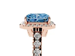 Fancy Blue Radiant Cut Diamond Halo Engagement Ring Set in Rose gold with Pavé Band and Prong-Set Center