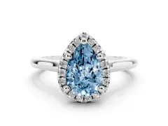 Fancy Blue Pear Cut Diamond Halo Engagement Ring Set in Platinum with Pavé Band and Rising Shoulders