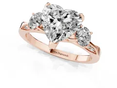 Heart Cut Diamond Three-Stone Ring Set in Rose gold with Pavé Band and Smaller Side Stones
