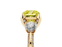Fancy Yellow Cushion Cut Diamond Three-Stone Ring Set in Yellow gold with Pavé Band and Smaller Side Stones