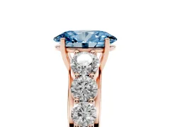 Fancy Blue Oval Cut Diamond Solitaire Ring Set in Rose gold with Pavé-Set Band and Prong Setting