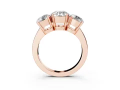 Round Cut Diamond Three-Stone Ring Set in Rose gold with Channel-Set Band and Prong Settings