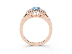 Fancy Blue Pear Cut Diamond Three-Stone Ring Set in Rose gold with Bold Center and Classic Band