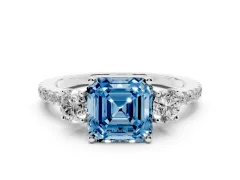 Fancy Blue Asscher Cut Diamond Three-Stone Ring Set in Platinum with Pavé Band and Graduated Sides