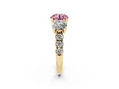 Fancy Pink Round Cut Diamond Three-Stone Ring Set in Yellow gold with Pavé Band
