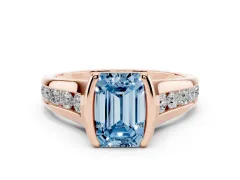 Fancy Blue Emerald Cut Diamond Bezel-Set Solitaire Ring Set in Rose gold with Channel-Set Band