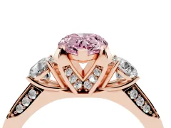 Fancy Pink Pear Cut Diamond Three-Stone Ring Set in Rose gold with Pavé Band and Smaller Side Stones