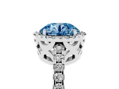Fancy Blue Round Cut Diamond Halo Ring Set in White gold with Pavé Shoulders and Halo-Framed Center