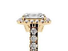 Emerald Cut Diamond Halo Engagement Ring Set in Yellow gold with Pavé Band and Prong-Set Center