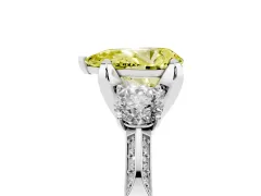 Fancy Yellow Pear Cut Diamond Three-Stone Ring Set in White gold with Pavé Band and Smaller Side Stones