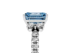 Fancy Blue Emerald Cut Diamond Three-Stone Pavé Ring Set in White gold with Prong Setting