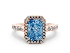 Fancy Blue Radiant Cut Diamond Halo Ring Set in Rose gold with Pavé Shoulders and Halo-Framed Center