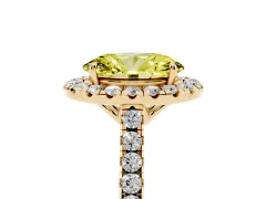 Fancy Yellow Oval Cut Diamond Pavé Halo Engagement Ring Set in Yellow gold with Pavé Band and Prong Setting