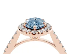 Fancy Blue Marquise Cut Diamond Pavé Halo Engagement Ring Set in Rose gold with Pavé Band and Prong Setting