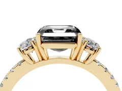 Fancy Black Asscher Cut Diamond Three-Stone Ring Set in Yellow gold with Pavé Band and Graduated Sides