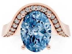 Fancy Blue Oval Cut Diamond Solitaire Engagement Ring Set in Rose gold with Pavé Shoulders