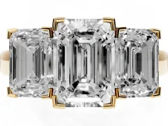 Emerald Cut Diamond Three-Stone Ring Set in Yellow gold with Channel-Set Band and Prong Settings