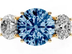 Fancy Blue Round Cut Diamond Three-Stone Ring Set in Yellow gold with Pavé Band