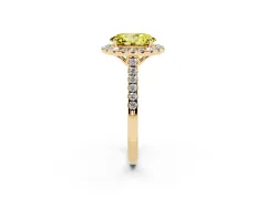 Fancy Yellow Oval Cut Diamond Pavé Halo Engagement Ring Set in Yellow gold with Pavé Band and Prong Setting