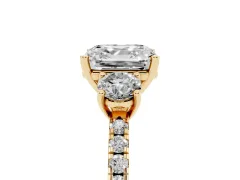 Asscher Cut Diamond Three-Stone Ring Set in Yellow gold with Pavé Band and Graduated Sides