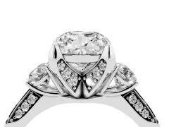 Cushion Cut Diamond Three-Stone Ring Set in Platinum with Pavé Band and Smaller Side Stones