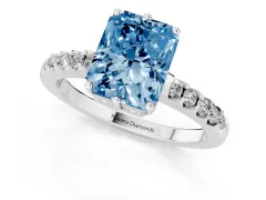 Fancy Blue Radiant Cut Diamond Solitaire Engagement Ring Set in White gold with Pavé Band and Prong Setting