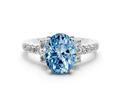 Fancy Blue Oval Cut Diamond Three-Stone Pavé Ring Set in Silver with Prong Setting