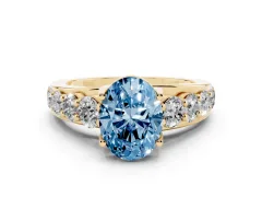 Fancy Blue Oval Cut Diamond Pavé Engagement Ring Set in Yellow gold with Prong Setting