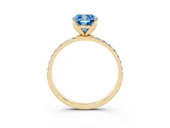 Fancy Blue Cushion Cut Diamond Solitaire Engagement Ring Set in Yellow gold with Round Pavé Band and Prong Setting