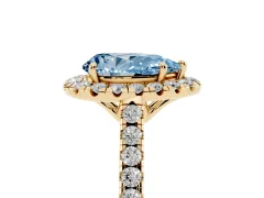 Fancy Blue Pear Cut Diamond Pavé Halo Engagement Ring Set in Yellow gold with Pavé Band and Prong Setting