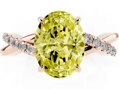 Fancy Yellow Oval Cut Diamond Twisted Pavé Band Ring Set in Rose gold with Prong Setting