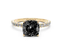 Fancy Black Cushion Cut Diamond Solitaire Engagement Ring Set in Yellow gold with Round Pavé Band and Prong Setting