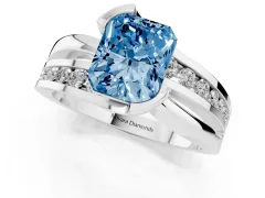 Fancy Blue Radiant Cut Diamond Solitaire Ring Set in White gold with Channel Set Split Shank and Tension Prongs