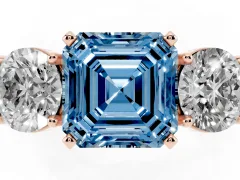 Fancy Blue Asscher Cut Diamond Three-Stone Ring Set in Rose gold with Round Side Stones and Classic Band