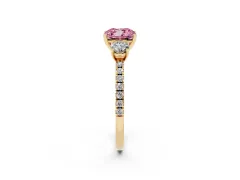 Fancy Pink Cushion Cut Diamond Three-Stone Ring Set in Yellow gold with Pavé Band and Graduated Sides