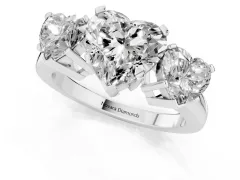 Heart Cut Diamond Three-Stone Ring Set in Platinum with Channel-Set Band and Prong Settings