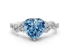 Fancy Blue Heart Cut Diamond Ring Set in White gold with Scattered Round Accents